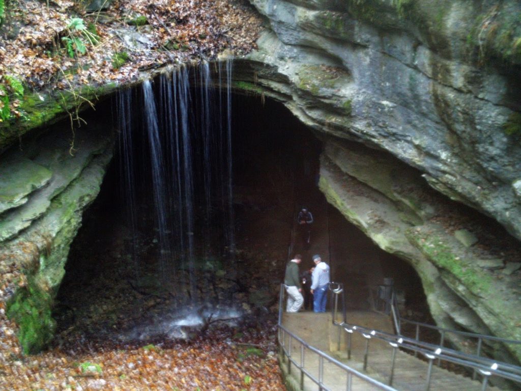 Water trickles down in a small waterfall above an entrance to Mammoth Cave.