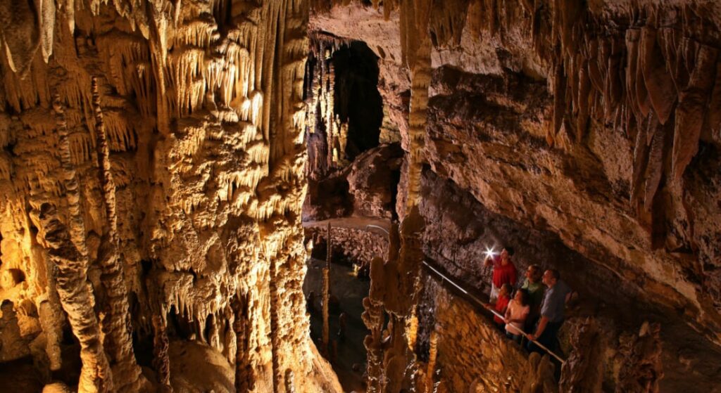 A picture showing the massive stalactites and cave formations inside Diamond Caverns.