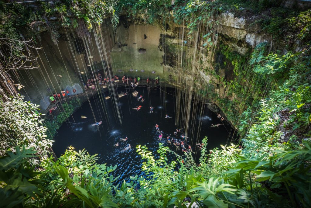 A look inside one of the cenotes of Mexico, where a crowd has gathered to go for scuba diving or to relax.